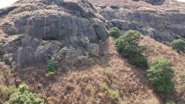 Ratangad rocky mountain slope and boulders aerial Maharashtra India