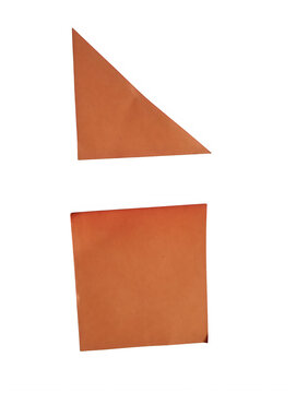 Orange paper shapes including a triangle and a square cut from construction paper isolated on transparent background