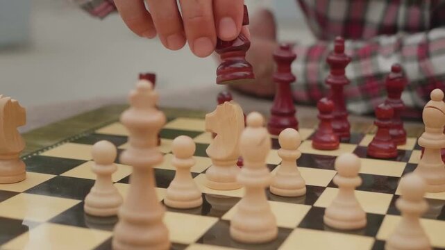 Strategic Chess Player Making a Move on Classic Wooden Board