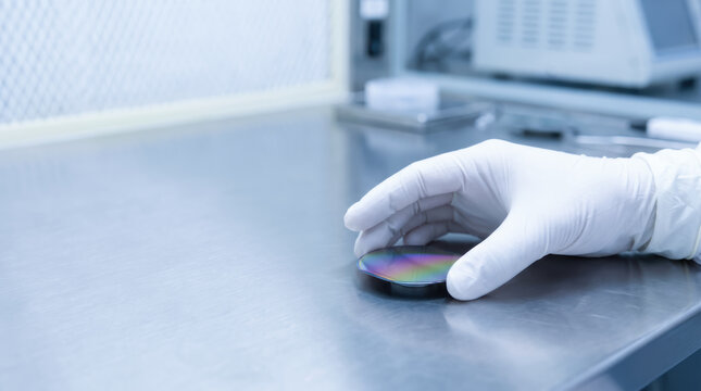 Semiconductor chip supply squeeze gloved hand laboratory bench clean room