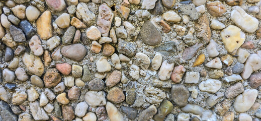 Pebble dash wall texture creating abstract pattern background © FlorianSchultze