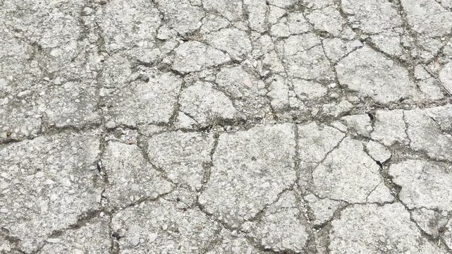 Cracked concrete road surface