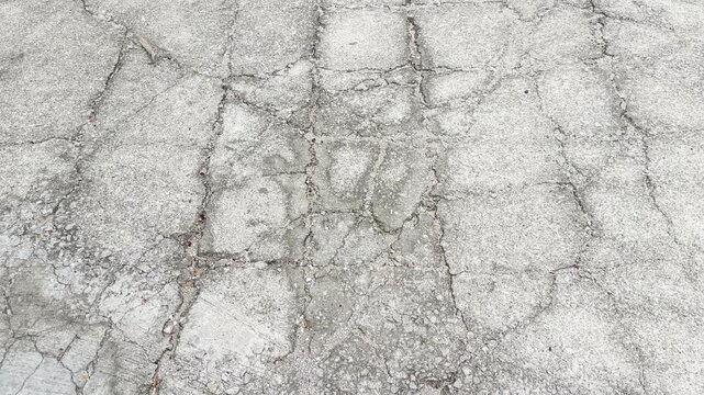 Cracked concrete road surface