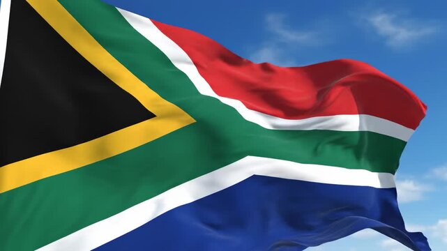 South African flag waving in blue sky