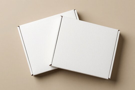 Two white carton mailer boxes sit on beige background. Flat square cardboard containers for shipping products lie together. Empty blank packaging packages represent delivery service logistic supply,