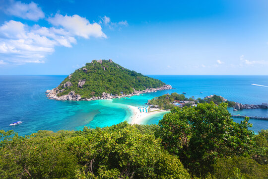 A breathtaking aerial view of Koh Nang Yuan, a stunning island in Thailand, showcasing its iconic sandbar and crystal-clear turquoise waters, in Suratthani, Thailand.
