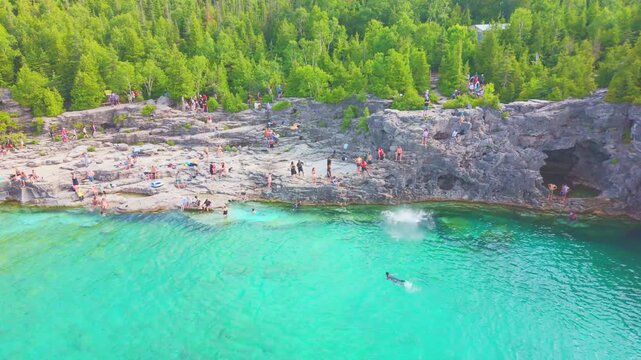 Bruce Penisula National Park, Canada - May 8 2026: Rugged limestone cliffs and crystal-clear turquoise waters frame the Georgian Bay shoreline near the famous Grotto in Bruce Peninsula National Park
