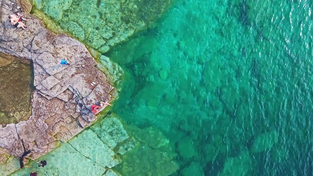 Bruce Penisula National Park, Canada - May 8 2026: Rugged limestone cliffs and crystal-clear turquoise waters frame the Georgian Bay shoreline near the famous Grotto in Bruce Peninsula National Park