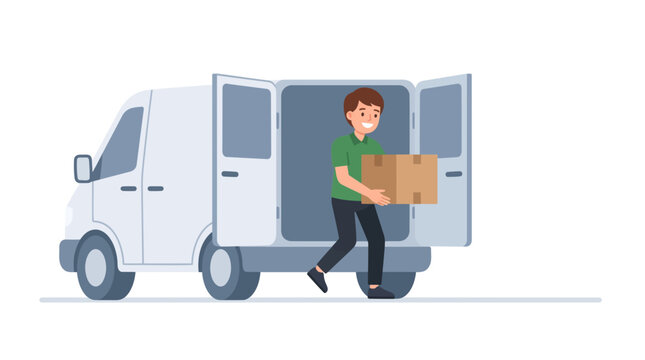 Delivery driver lifting a box from a van. Young courier loading parcel in a commercial vehicle.
