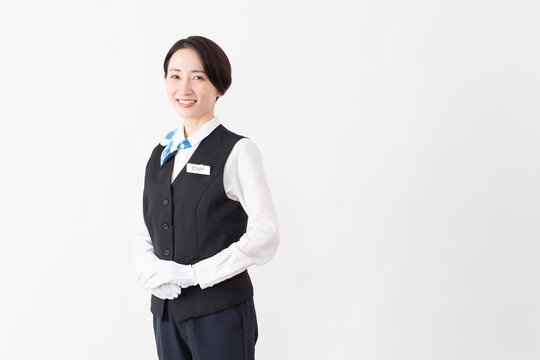 制服を着たアテンダントの女性　旅行イメージ