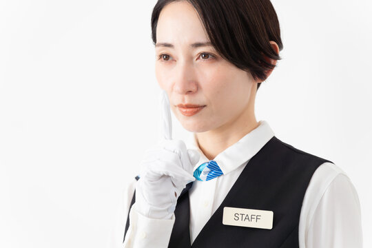 制服を着たアテンダントの女性　旅行イメージ