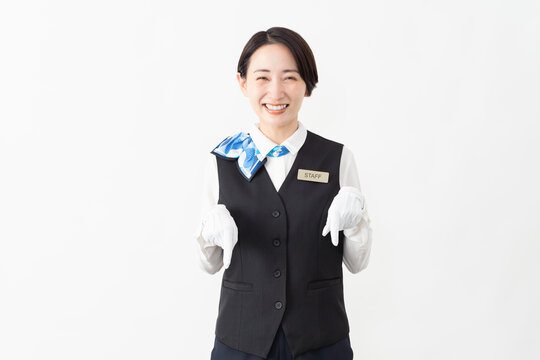 制服を着たアテンダントの女性　旅行イメージ