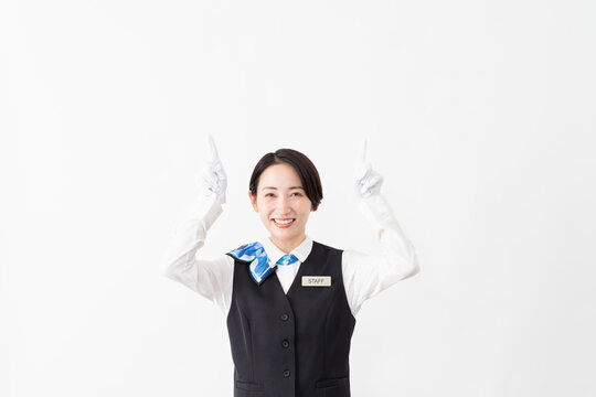 制服を着たアテンダントの女性　旅行イメージ
