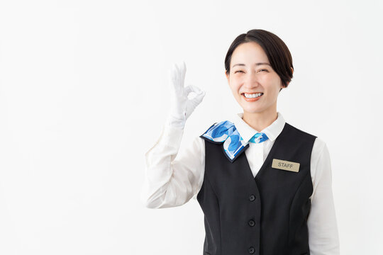 制服を着たアテンダントの女性　旅行イメージ