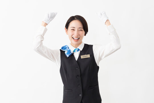 制服を着たアテンダントの女性　旅行イメージ