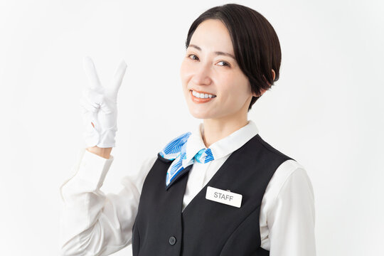 制服を着たアテンダントの女性　旅行イメージ