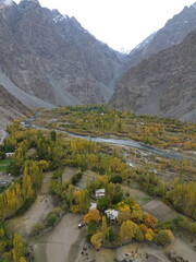 Aerial View of River Valley and Village in Mountainous Landscape © Phuc