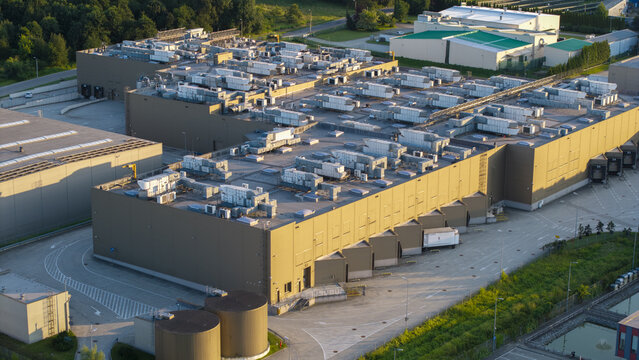 Dobczyce, Poland - 22 July 2026: Aerial view of the Wawel SA production facility with industrial rooftops, ventilation units, and loading docks in the surrounding landscape.