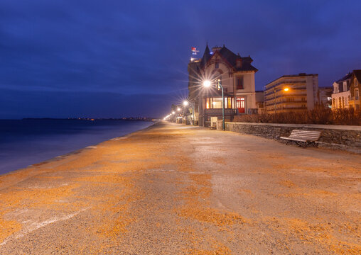 Seaside Promenade at Dawn with Historic Villa in Saint Malo Brittany France
