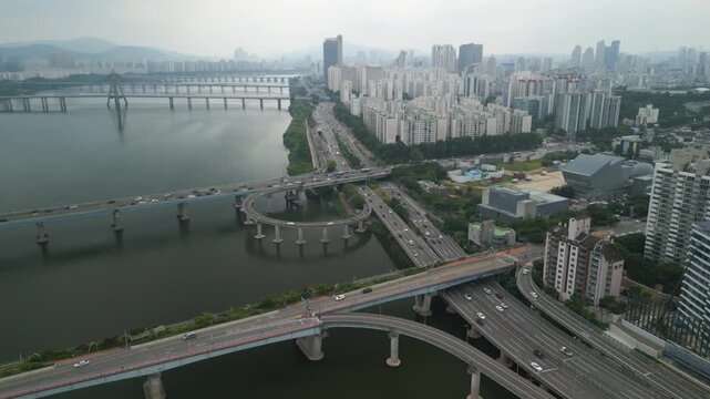 4K Drone of Hangang River by Gwangnaru Hangang Park and Gwangjin Bridge on a Cloudy Day