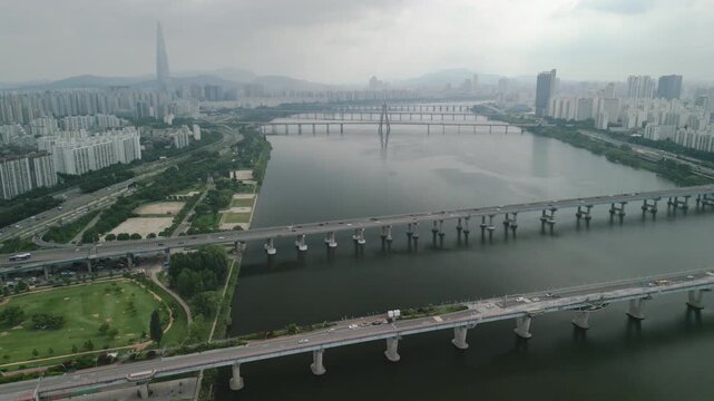 4K Drone of Hangang River by Gwangnaru Hangang Park and Gwangjin Bridge on a Cloudy Day
