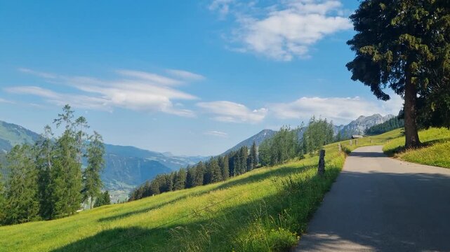 Summer hiking paradise near Lenk in the Swiss Alps, featuring lush green meadows, peaceful mountain scenery, and fresh alpine air under a clear blue sky. Tranquil landscape and beauty in Switzerland