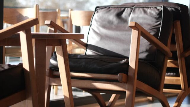 Caf&eacute; interior with wooden chairs and leather seats