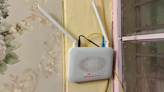 Fiber Broadband Router Displaying Connection Loss Warning Light Indoors
