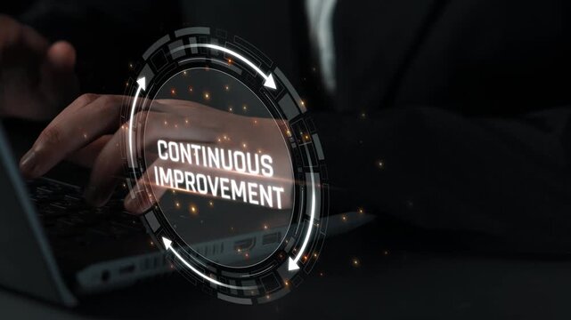 Professional hand typing on laptop keyboard with focus on continuous improvement concept in a dark environment emphasizing technology and innovation Sigmoid