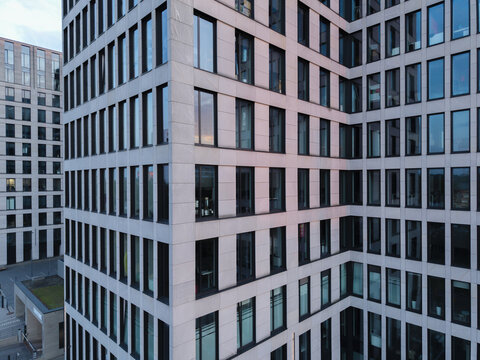 Krakow, Malopolska, Poland - 18 July 2026: Aerial view of O3 Business Campus featuring modern glass and stone facade architecture with reflective windows.