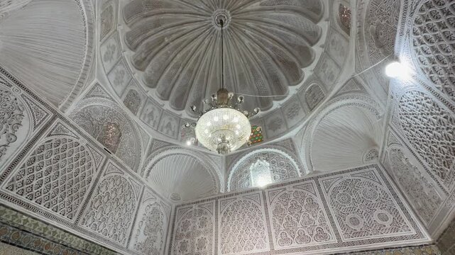Ornate Domed Ceiling and Chandelier in Zawiya of Sidi Sahib also known as the Zawiya of Abu al-Balawi or Mosque of the Barber in Kairouan. Tunisia.