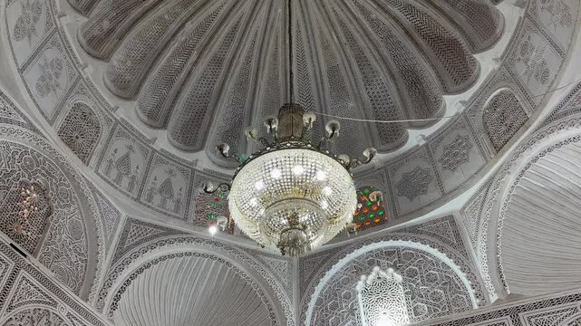 Ornate Domed Ceiling and Chandelier in Zawiya of Sidi Sahib also known as the Zawiya of Abu al-Balawi or Mosque of the Barber in Kairouan, Tunisia.