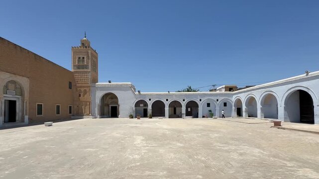 Zawiya of Sidi Sahib also known as the Zawiya of Abu al-Balawi or Mosque of the Barber under bright midday light in Kairouan, Tunisia.