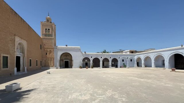 Wide shot of historic Zawiya of Sidi Sahib also known as the Zawiya of Abu al-Balawi or Mosque of the Barber in Kairouan, Tunisia.