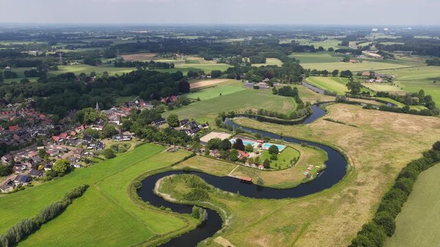 Aerial view of the Berkel River in the Dutch Achterhoek, showing meandering water, restored riverbanks, rural landscapes and natural water management in Gelderland.