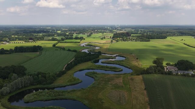 Aerial view of the Berkel River in the Dutch Achterhoek, showing meandering water, restored riverbanks, rural landscapes and natural water management in Gelderland.