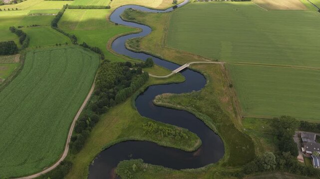 Aerial view of the Berkel River in the Dutch Achterhoek, showing meandering water, restored riverbanks, rural landscapes and natural water management in Gelderland.