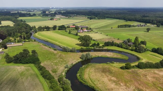Aerial view of the Berkel River in the Dutch Achterhoek, showing meandering water, restored riverbanks, rural landscapes and natural water management in Gelderland.