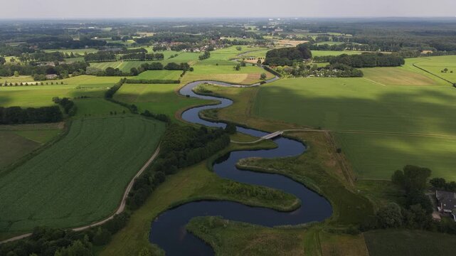 Aerial view of the Berkel River in the Dutch Achterhoek, showing meandering water, restored riverbanks, rural landscapes and natural water management in Gelderland.
