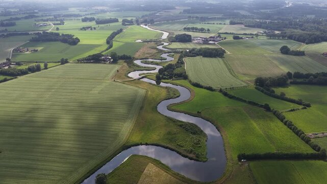 Aerial view of the Berkel River in the Dutch Achterhoek, showing meandering water, restored riverbanks, rural landscapes and natural water management in Gelderland.