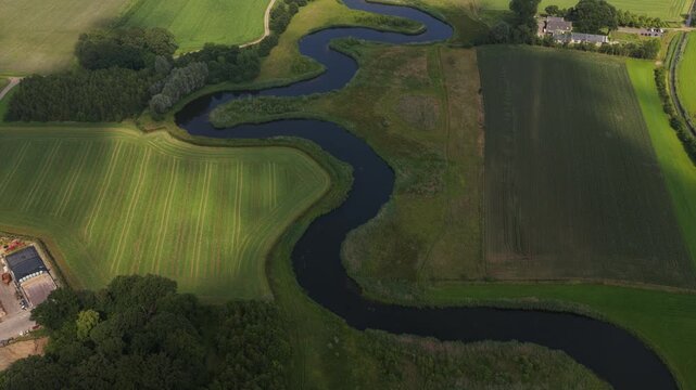 Aerial view of the Berkel River in the Dutch Achterhoek, showing meandering water, restored riverbanks, rural landscapes and natural water management in Gelderland.
