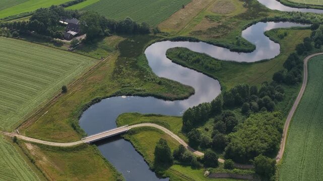 Aerial view of the Berkel River in the Dutch Achterhoek, showing meandering water, restored riverbanks, rural landscapes and natural water management in Gelderland.