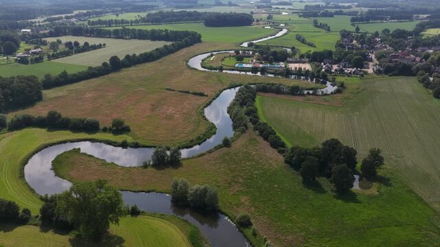 Aerial view of the Berkel River in the Dutch Achterhoek, showing meandering water, restored riverbanks, rural landscapes and natural water management in Gelderland.