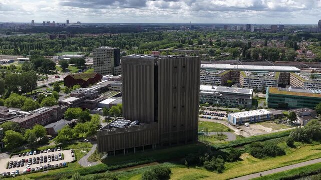 Aerial view of a large scale data center tower building, showing cloud computing infrastructure, digital storage, secure server facilities and modern IT operations.