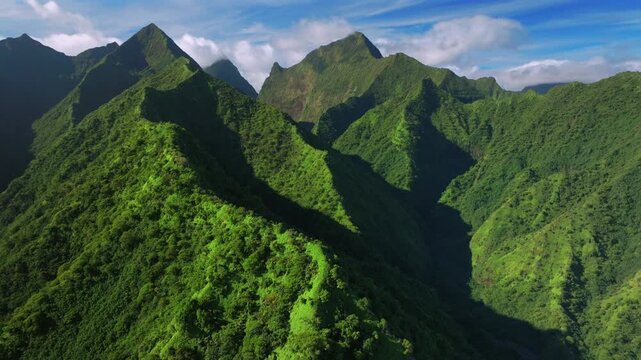 Tahiti Ito Volcano Tara Huhurahi Ridge mountains of Teahupo'o South Pacific Island French Polynesia aerial drone afternoon sunny blue sky clouds Mount Ronui Aorai Orohena Vaiau River Valley forward up