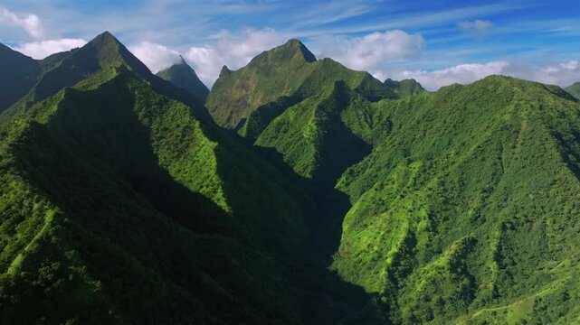 Tahiti Ito Volcano mountains peaks of Teahupo'o South Pacific Island French Polynesia aerial drone afternoon sunny blue sky Tara Huhurahi Ridge Mount Ronui Aorai Orohena Vaiau River Valley circle left