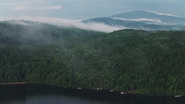 Lake Schroon rainy mist low clouds sunset aerial drone Steep Bay Town of Schroon Lake Up State New York Pharaoh Mtn Adirondack Mountains June July summer harbor view lake homes landscape circle left