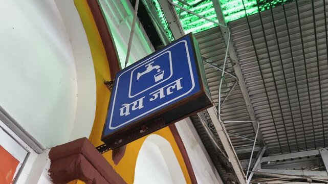 Orbiting close up of a drinking water sign mounted inside Jabalpur Railway Station in Madhya Pradesh India Editorial use only
