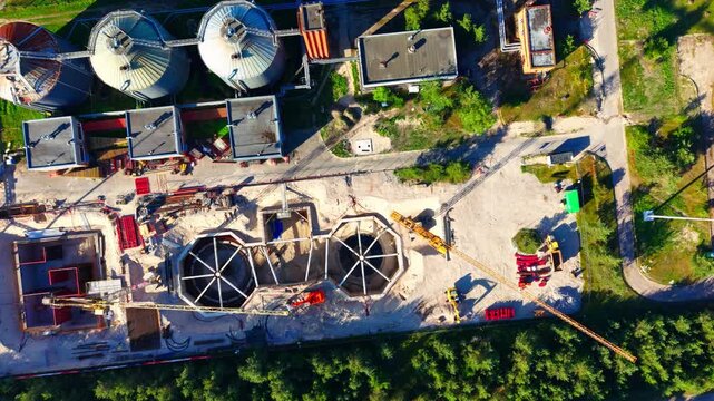 Vertical drone view of digesters expanding renewable energy capacity in Latvia