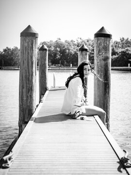 She waits on the dock in the bay.